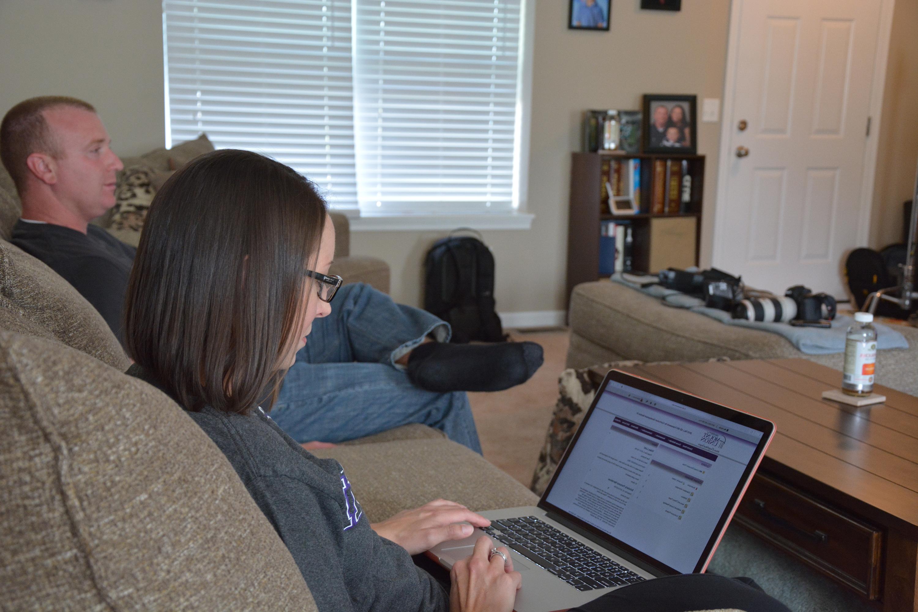 female student on computer at home